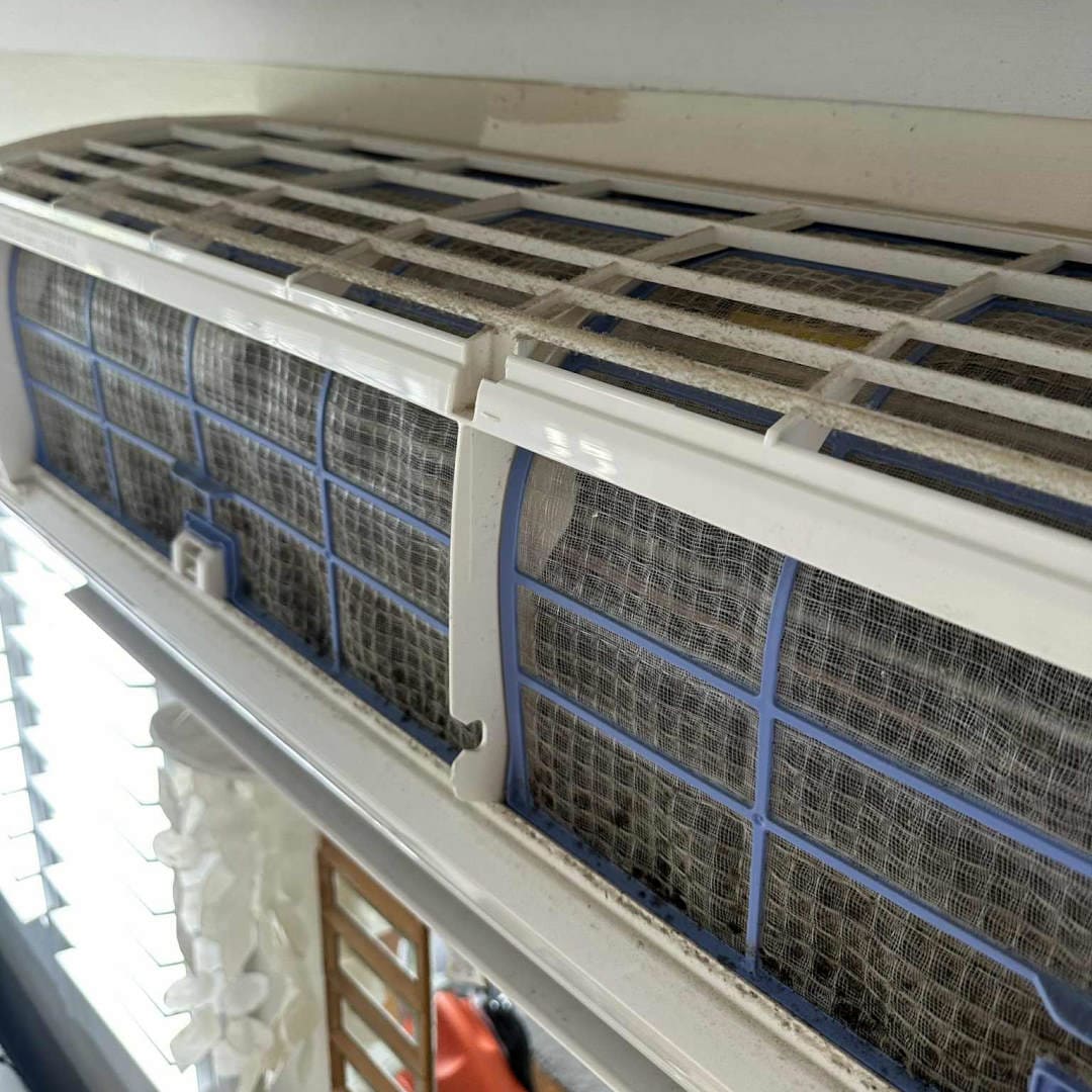 Close up of mould and dirt on a split system air conditioner in brisbane