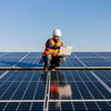 man on a roof doing a insurance inspection report for a solar system in Brisbane
