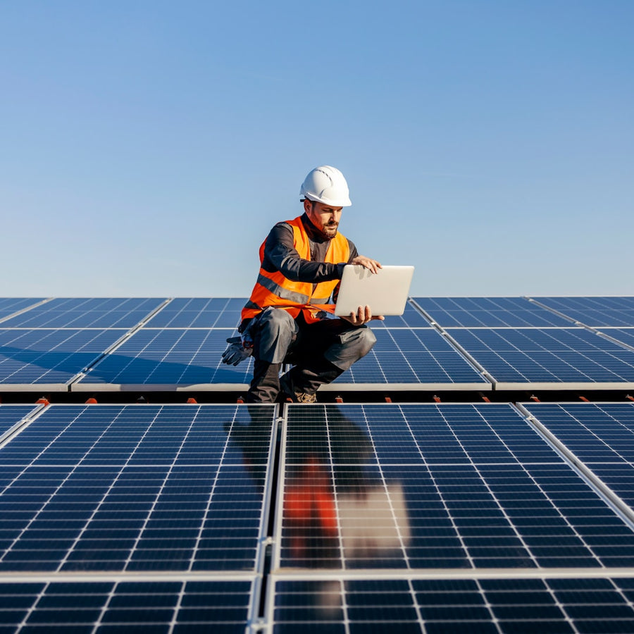 man on a roof doing a insurance inspection report for a solar system in Brisbane