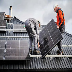 two employees at Solair Electrical removing solar panels in Brisbane